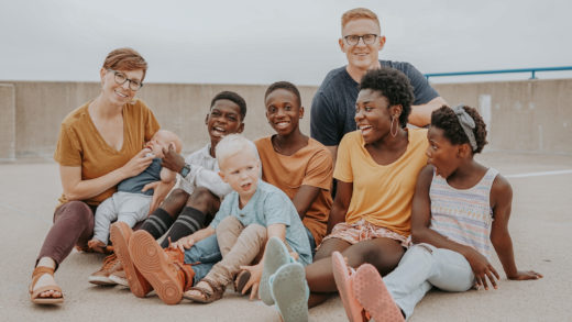 People sitting on the ground laughing